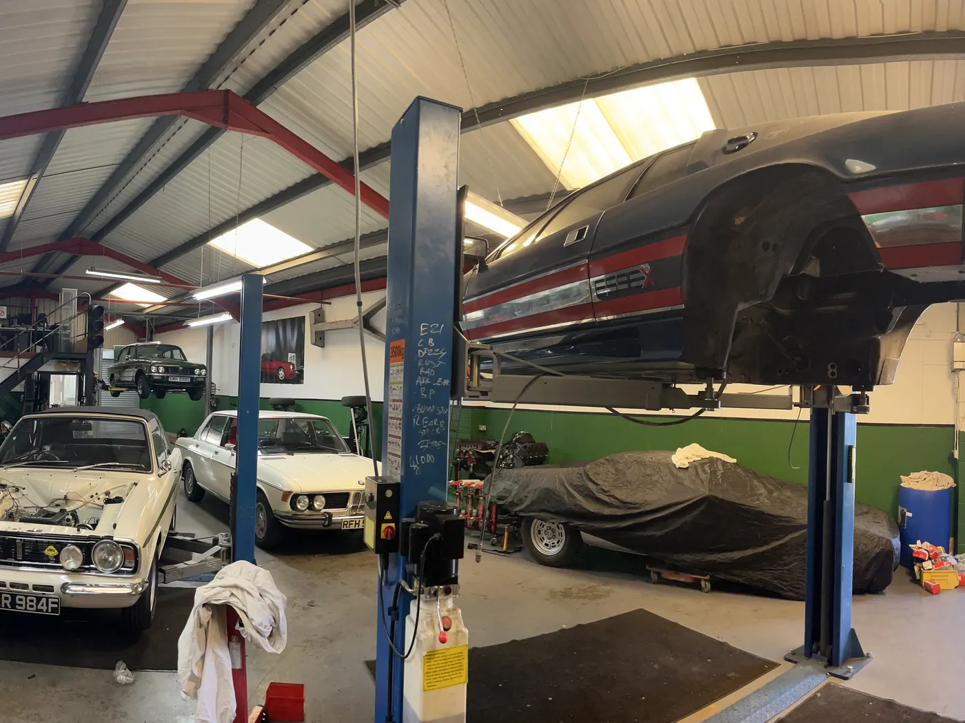 Goblin Automotive workshop with classics on ramps